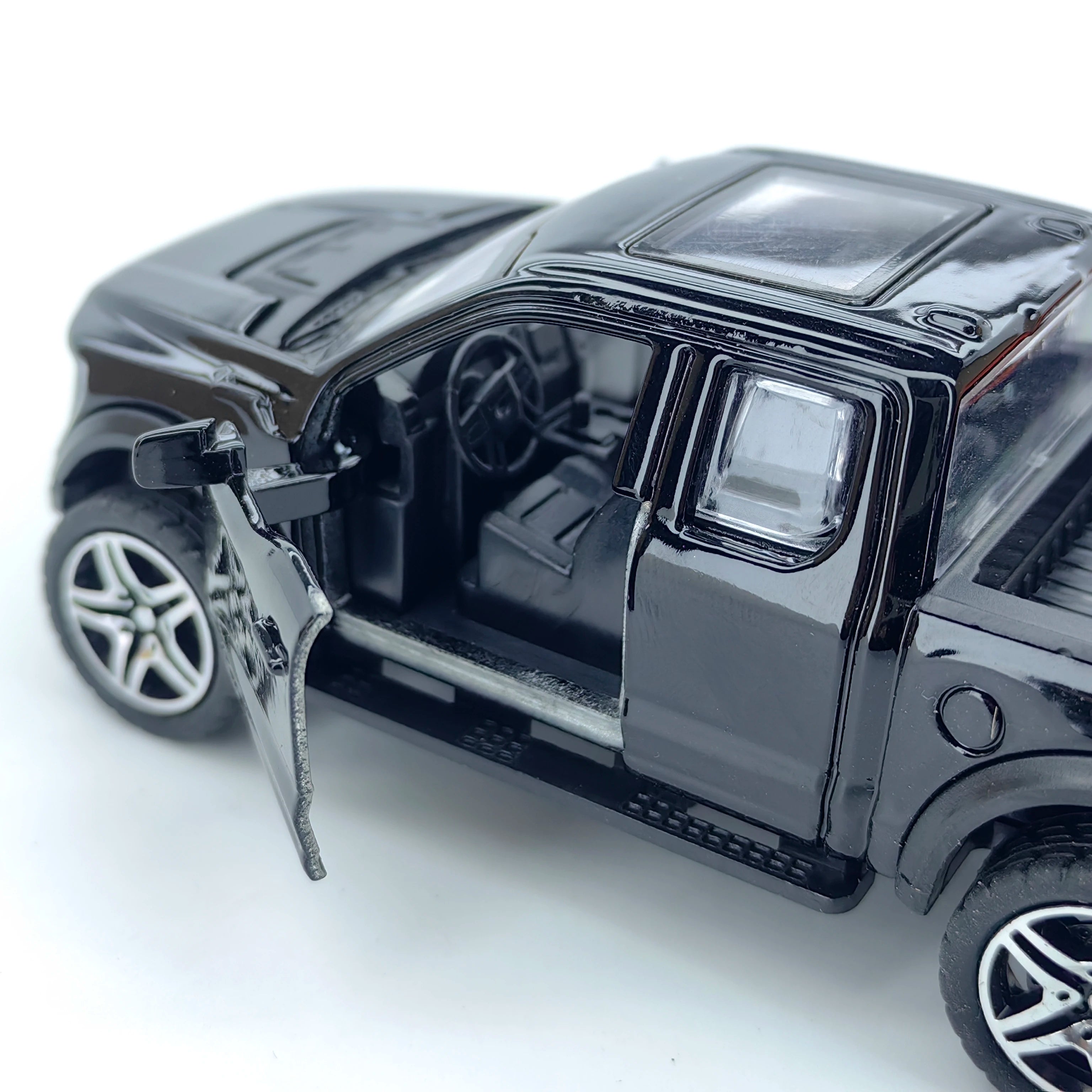 Boy’s treasured metal miniature racing car, realistic spring-powered off-road vehicle, baby-sized toy car.